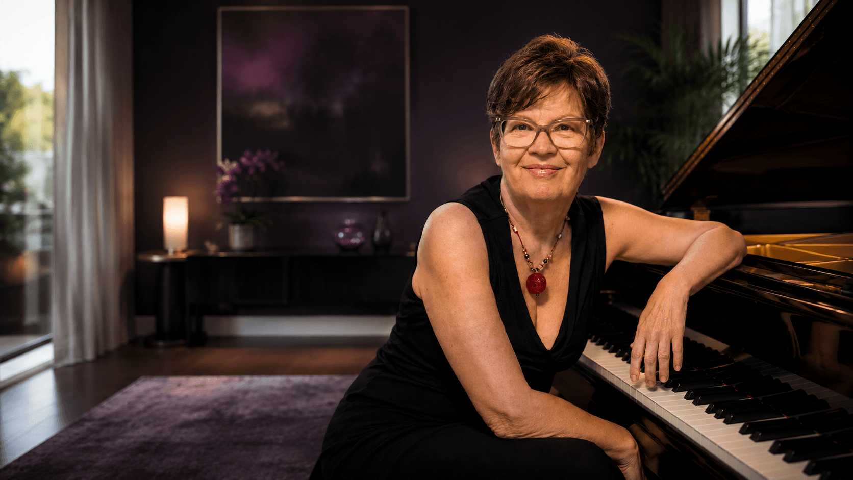 Mary Laymon performing on stage with piano accompaniment - Mary Laymon Voice Studio